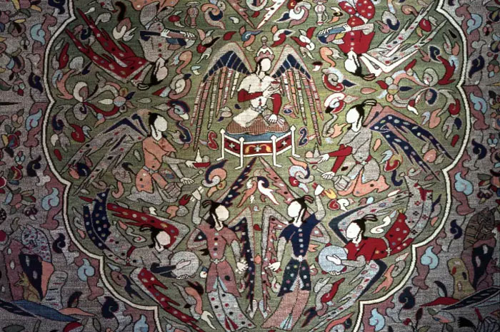 Persian style carpet, In the central medallion Mohammed on a throne is surrounded by angels dancing, playing music and offering food. It is thought to be a representation of paradise. The ban in figural art is observed by the omission of faces. India. Moghul. 17th century. (Photo by Werner Forman/Universal Images Group/Getty Images) 